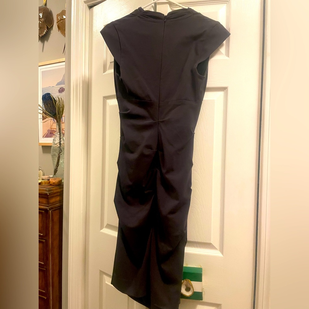 Great dress and a gorgeous material. It is a dark gray, and it is knee length.